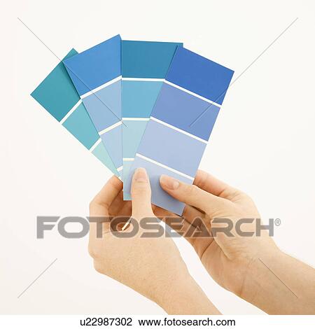 Hands holding paint color swatches View Large Photo Image Stock Image - Hands holding paint color swatches. Fotosearch