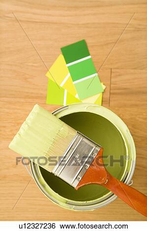 High angle view of paintbrush resting on paint can with color samples. View Large Photo Image Stock Photograph - High angle view of paintbrush resting on paint can with color samples.. Fotosearch