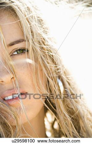 Stock Image - Close up headshot of pretty blond Caucasian woman.. Fotosearch