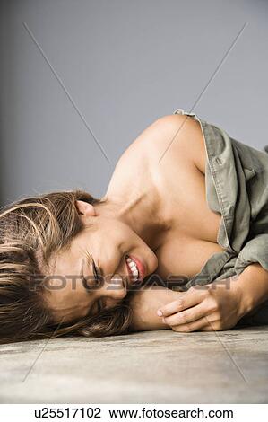 Female lying on ground View Large Photo Image Stock Image - Female lying on ground. Fotosearch
