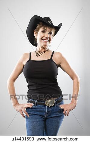 Portrait of pretty woman in western wear smiling View Large Photo Image Stock Image - Portrait of pretty woman in western wear smiling. Fotosearch