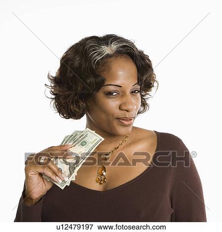 Portrait of woman holding twenty dollar bills in hand View Large Photo Image Stock Photo - Portrait of woman holding twenty dollar bills in hand. Fotosearch