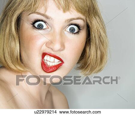Blonde woman with angry expression View Large Photo Image Picture - Blonde woman with angry expression. Fotosearch