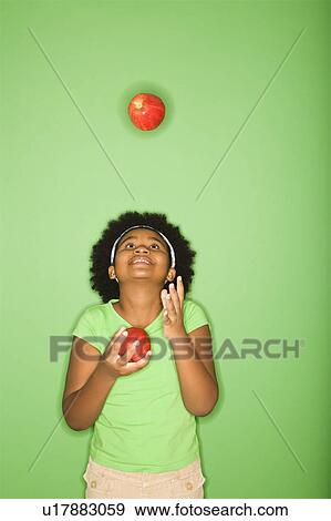 Girl juggling apples View Large Photo Image Stock Photo - Girl juggling apples. Fotosearch