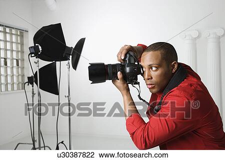 Photographing in studio View Large Photo Image Stock Image - Photographing in studio. Fotosearch