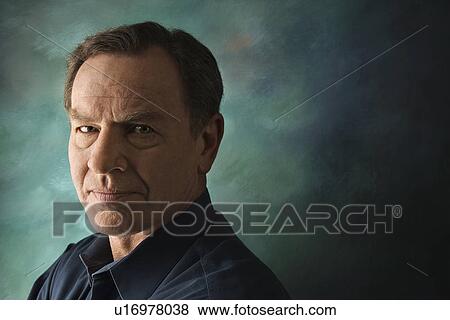 Stock Photo - Serious middle-aged man on studio background.. Fotosearch