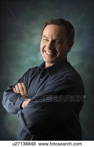 Smiling man with arms crossed View Large Photo Image Stock Photo - Smiling man with arms crossed. Fotosearch