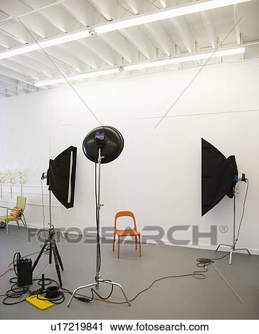 Studio shot of photographic lights aimed at red plastic chair. View Large Photo Image Stock Image - Studio shot of photographic lights aimed at red plastic chair.. Fotosearch
