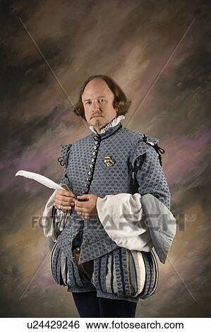 William Shakespeare in period clothing holding feather pen standing View Large Photo Image Stock Photograph - William Shakespeare in period clothing holding feather pen standing . Fotosearch