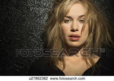 Woman With Tousled Hair Looking Stock Image U27862382 Fotosearch