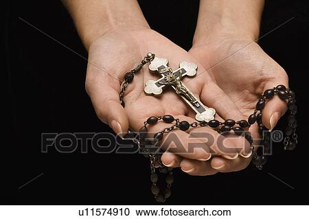 Woman's hands palm up cradling rosary with crucifix. View Large Photo Image Stock Image - Woman's hands palm up cradling rosary with crucifix.. Fotosearch
