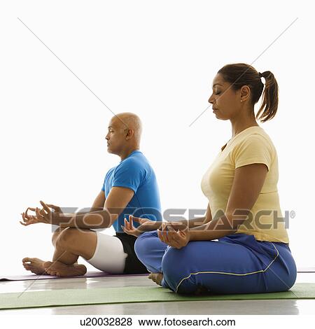Man and woman sitting in lotus position View Large Photo Image Stock Photo - Man and woman sitting in lotus position. Fotosearch