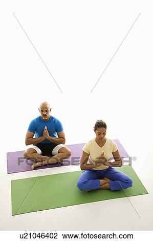 Sitting in Namaste position View Large Photo Image Stock Image - Sitting in Namaste position . Fotosearch