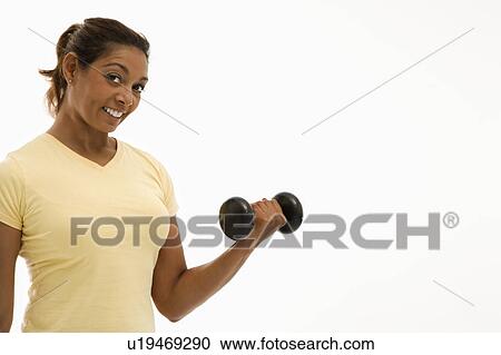 Woman doing arm curls View Large Photo Image Stock Image - Woman doing arm curls . Fotosearch
