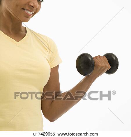 Woman doing arm curls View Large Photo Image Stock Photography - Woman doing arm curls. Fotosearch