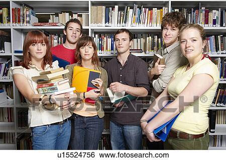 Group of young people in a library View Large Photo Image Stock Photograph - Group of young people in a library. Fotosearch