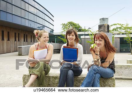 Three young women on campus View Large Photo Image Picture - Three young women on campus. Fotosearch