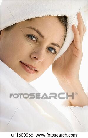 Caucasian mid-adult woman wearing robe and towel on head looking at viewer with hand to head. View Large Photo Image Stock Photography - Caucasian mid-adult woman wearing robe and towel on head looking at viewer with hand to head.. Fotosearch