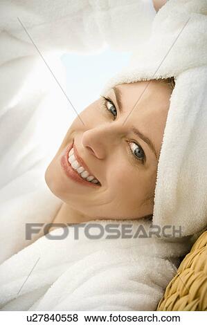 Caucasian mid-adult woman wearing towel on head smiling at viewer. View Large Photo Image Stock Photo - Caucasian mid-adult woman wearing towel on head smiling at viewer.. Fotosearch