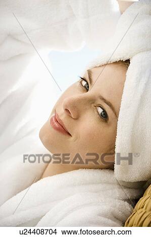 Woman wearing towel on head looking at viewer View Large Photo Image Picture - Woman wearing towel on head looking at viewer. Fotosearch