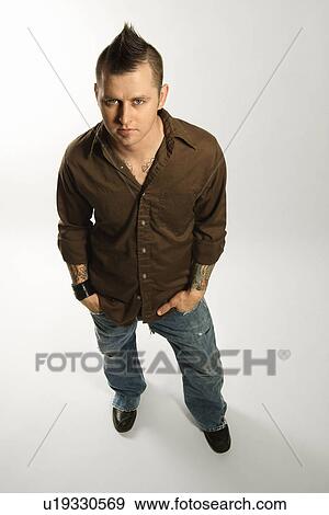 Caucasian man with mohawk against white background. View Large Photo Image Stock Photo - Caucasian man with mohawk against white background.. Fotosearch