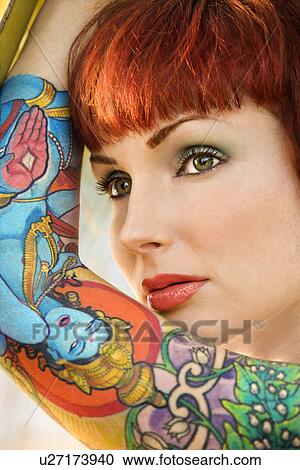 Close up portrait of attractive tattooed Caucasian woman View Large Photo Image Stock Image - Close up portrait of attractive tattooed Caucasian woman . Fotosearch