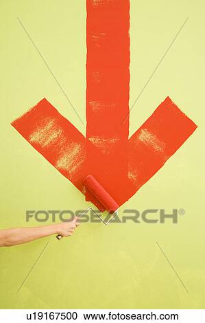 Female hand painting red downwards arrow on wall View Large Photo Image Stock Image - Female hand painting red downwards arrow on wall. Fotosearch