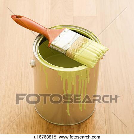 Paintbrush resting on paint can on wood floor View Large Photo Image Stock Photography - Paintbrush resting on paint can on wood floor. Fotosearch