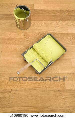 Still life of paint roller in tray with paint can on wood floor. View Large Photo Image Stock Image - Still life of paint roller in tray with paint can on wood floor.. Fotosearch