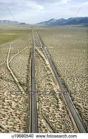 Aerial of desolate scenic highway through rural desert landscape of California, USA. View Large Photo Image Stock Image - Aerial of desolate scenic highway through rural desert landscape of California, USA.. Fotosearch