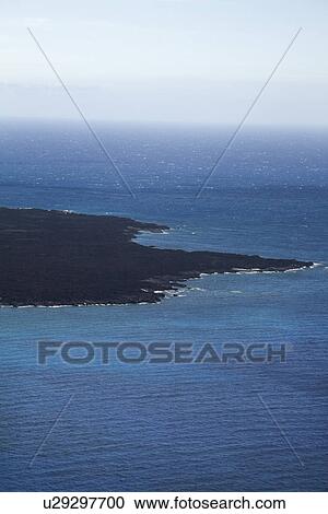 Aerial of lava rock coastline jutting into Pacific ocean on Maui, Hawaii. View Large Photo Image Stock Image - Aerial of lava rock coastline jutting into Pacific ocean on Maui, Hawaii.. Fotosearch