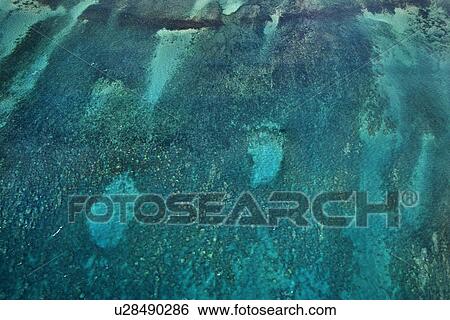 Aerial of reef seen through blue Pacific ocean. View Large Photo Image Stock Photograph - Aerial of reef seen through blue Pacific ocean.. Fotosearch