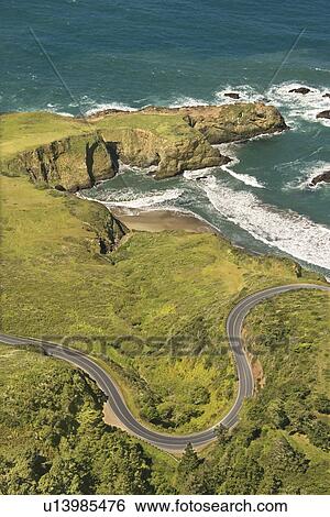 Aerial of winding road Shoreline Highway on west coast with Pacific Ocean in California View Large Photo Image Stock Photograph - Aerial of winding road Shoreline Highway on west coast with Pacific Ocean in California. Fotosearch