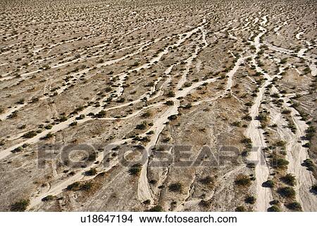 Aerial view of desert landscape with washes and bushes View Large Photo Image Picture - Aerial view of desert landscape with washes and bushes. Fotosearch