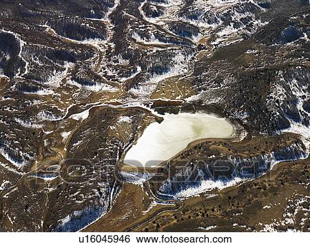 Stock Photograph - Aerial view of snow covered rural Colorado. Fotosearch