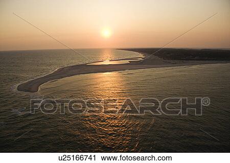 Aerial view of sun over Atlantic ocean and shoreline of Bald Head Island, North Carolina. View Large Photo Image Stock Image - Aerial view of sun over Atlantic ocean and shoreline of Bald Head Island, North Carolina.. Fotosearch