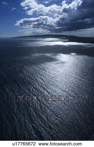 Island in Pacific ocean with puffy clouds View Large Photo Image Stock Image - Island in Pacific ocean with puffy clouds. Fotosearch