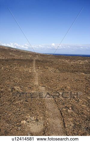 Pathway leading through rocky terrain in Maui, Hawaii View Large Photo Image Stock Image - Pathway leading through rocky terrain in Maui, Hawaii. Fotosearch