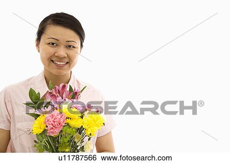 Stock Photograph - Holding bouquet of flowers. Fotosearch