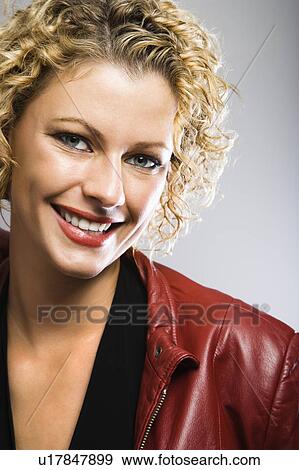 Stock Photo - Blond Caucasian young adult woman smiling at viewer.. Fotosearch