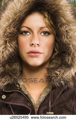 Caucasian young adult woman wearing fur hood looking at viewer. View Large Photo Image Stock Photography - Caucasian young adult woman wearing fur hood looking at viewer.. Fotosearch
