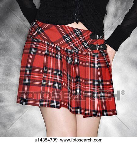 Hips and legs of Caucasian young woman wearing short plaid skirt. View Large Photo Image Stock Photo - Hips and legs of Caucasian young woman wearing short plaid skirt.. Fotosearch