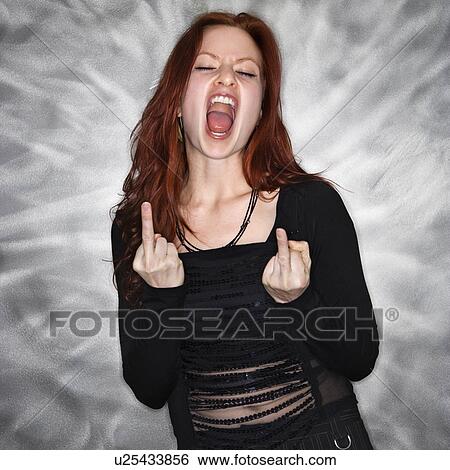 Portrait of pretty young redhead woman giving middle finger gesture. View Large Photo Image Stock Photograph - Portrait of pretty young redhead woman giving middle finger gesture.. Fotosearch