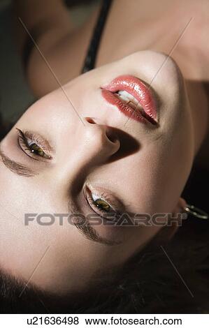 Sexy Caucasian woman lying down looking up at viewer. View Large Photo Image Stock Photo - Sexy Caucasian woman lying down looking up at viewer.. Fotosearch