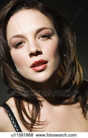 Stock Photo - Young Caucasian woman looking at viewer.. Fotosearch