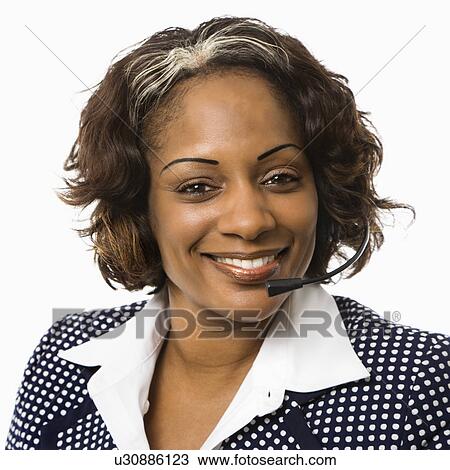 Head and shoulder of smiling businesswoman talking on telephone headset. View Large Photo Image Stock Image - Head and shoulder of smiling businesswoman talking on telephone headset.. Fotosearch