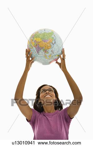Woman holding globe over head View Large Photo Image Stock Image - Woman holding globe over head. Fotosearch