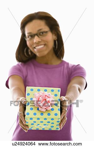 Picture - Woman holding wrapped package. Fotosearch