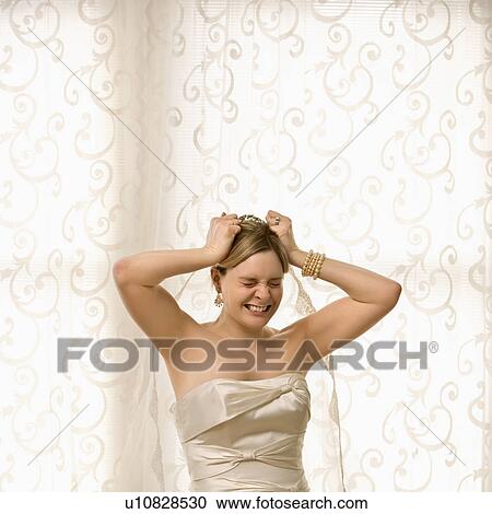 Bride pulling at hair and veil View Large Photo Image Stock Image - Bride pulling at hair and veil. Fotosearch