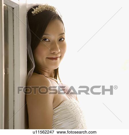 Stock Photo - Portrait of a bride looking at viewer. Fotosearch